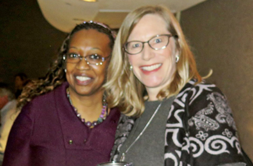 Karen Harris and Darcy Davis standing together for a photo